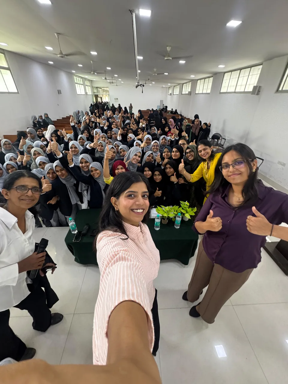 Students and healthcare professionals gathered after a women’s health education session