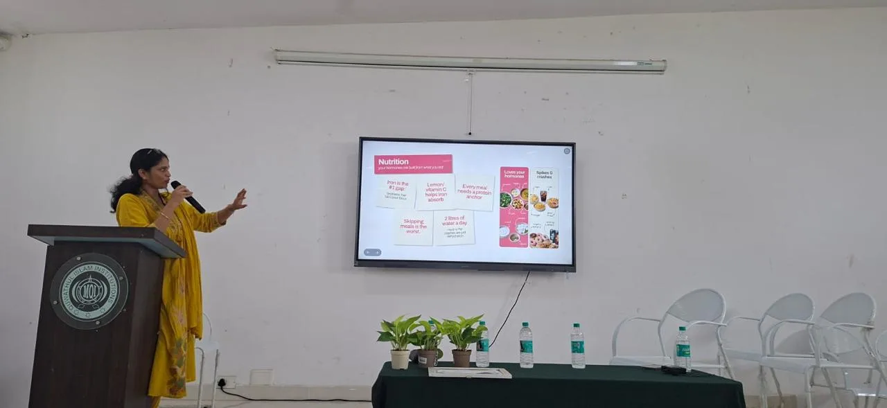 Dr. Aruna speaking at a women’s health education session
